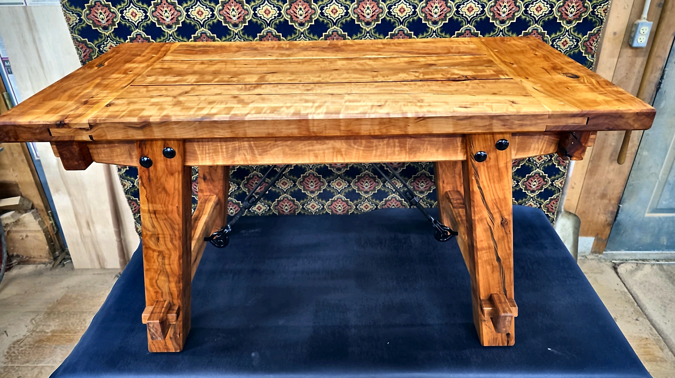 Carved wood table with turned legs